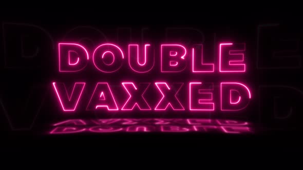 Words 'DOUBLE VAXXED' neon glowing on a black background with reflections on a floor alt
