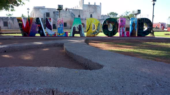 Slow aerial push in and fly over the Valladolid tourist sign in from the Convent de San Bernardino i