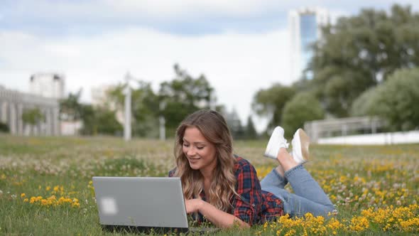 Woman Student Using Laptop Computer for Study Online