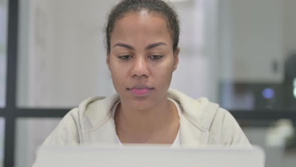 Close Up of African Woman with Laptop Shaking Head As Yes