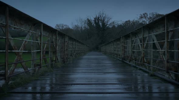 Old Industrial Bridge Over River At Dusk