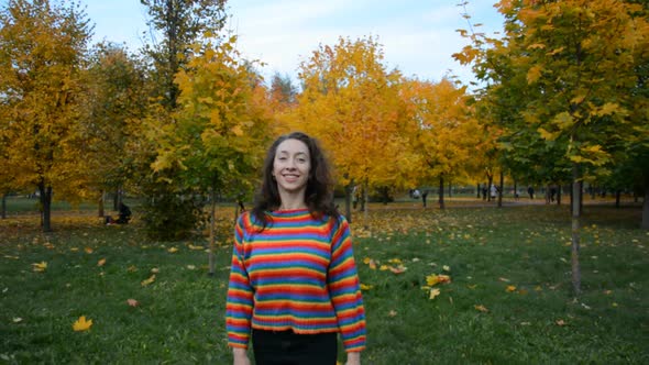 Beautiful and Happy Girl Walks Outdoor