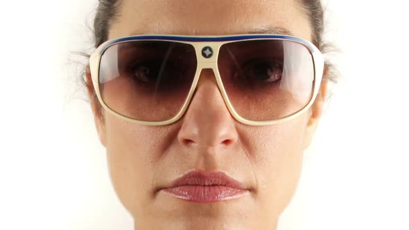 pretty woman wearing different retro sunglasses