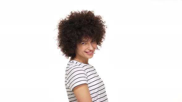 Close Up Portrait of Charming Lady Having Cool Afro Hairstyle Looking on Camera Smiling Happily with