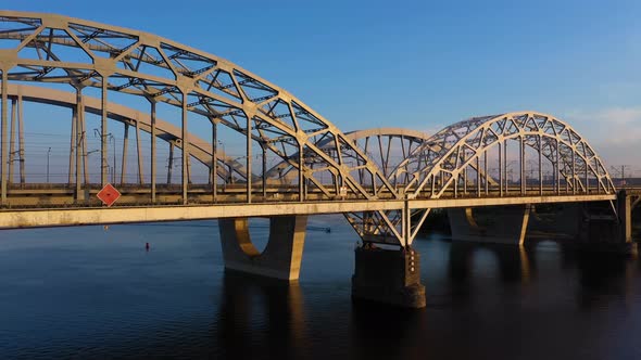 Aerial Side View of a Highway Bridge Over the River