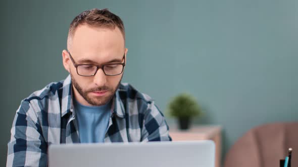 Focused Male Freelancer Chatting Working Remotely Use Laptop