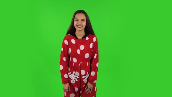 Beautiful Girl in Red Fleece Pajamas Is Laughing. Green Screen