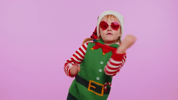 Girl Christmas Santa Claus Elf Listening Music Via Earphones Dancing Disco Fooling Around Having Fun