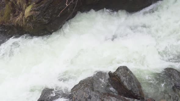 Water passing to a creek in Svandalsfossen waterfall, Norway_slomo