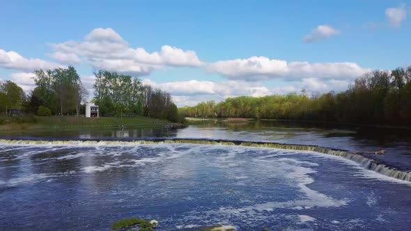 Flying Fish at Ventas Rumba The Widest Waterfall in Europe in Latvia Kuldiga, Aerial Dron Shot