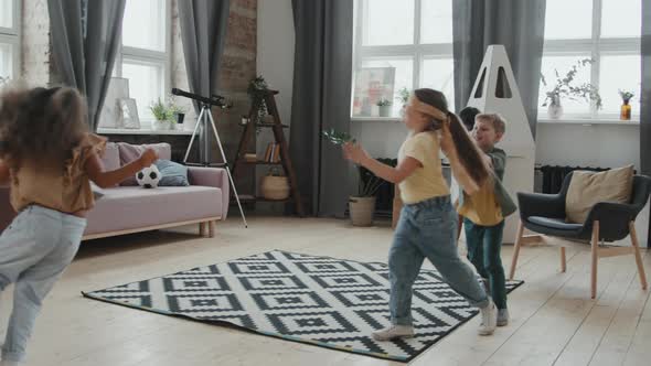 Happy Little Girls Playing Tag at Home