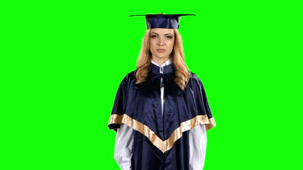 Graduate Threatening Finger and Shows Sign Quietly. Green Screen