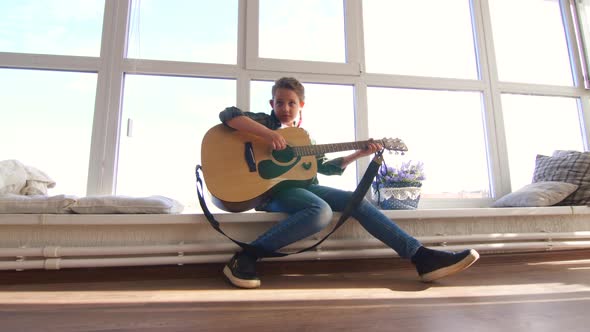 10 Years Old Girl Learning to Play the Guitar