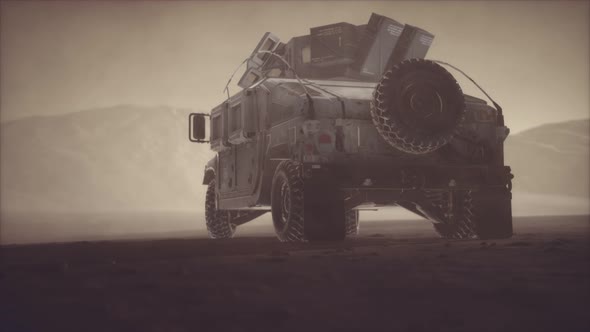 Military Patrol Car on Sunset in Desert Storm