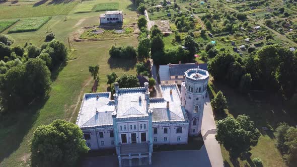 Vecauce Manor in Latvia Aerial View of the Pink Castle Through the Park. Vecauce Castle Tower With a