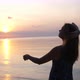 Beautiful Woman Enjoying Peaceful Seaside at Sunset - VideoHive Item for Sale