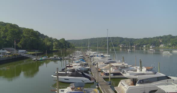 Backwards Pan of Boats Docked at a Marina in Cold Spring Harbor Long Island