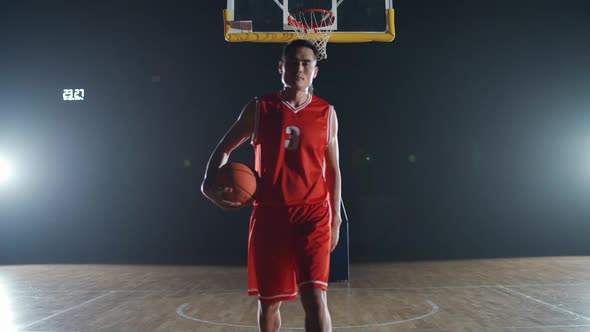 Portrait of an Asian Man Basketball Player Serious Looking and Standing in Front of the Camera