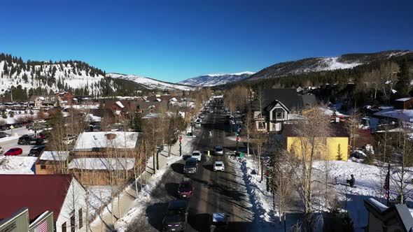 Small, snowy town in the rural countryside of Colorado, USA. Aerial fly over