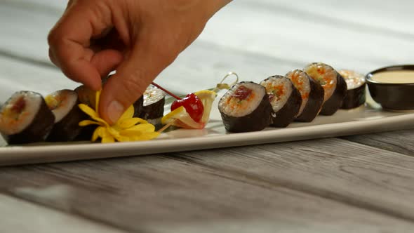 Yellow Flowers on Sushi Plate.