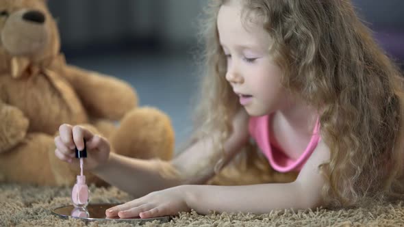 Tender Little Girl Painting Nails With Polish, Kid Dreaming to Grow Up Soon