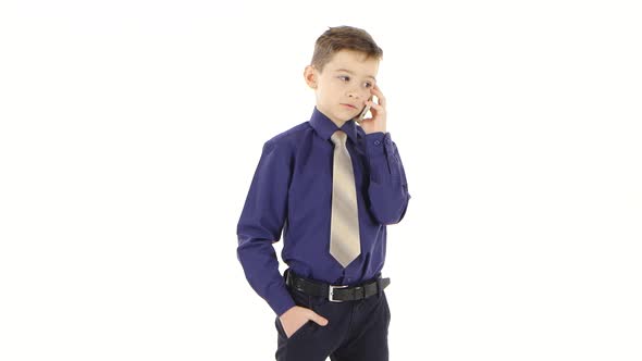 Businessman Boy Child Speaks on Smartphone. White Background Isolated Studio