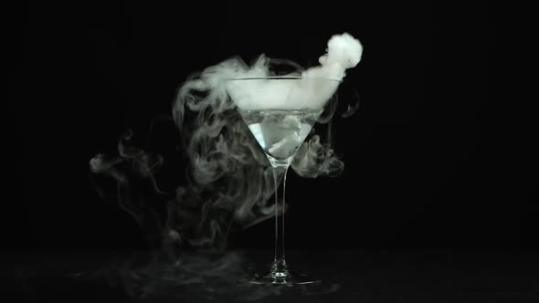 Drink in Glass of Martinis with the Effect of Dry Ice