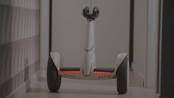 White Modern Gyro Scooter Gadget Balances Itself and Spins with Intelligence Avoids Obstacles in the