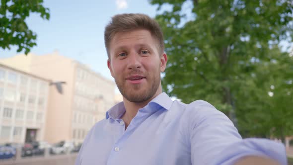 Young Caucasian Man Smiling Happy Doing Video Call at City