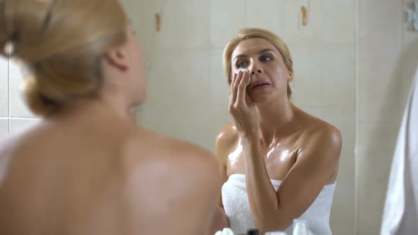 Lady Creaming Face With Sponge, Preparing for Night Sleep, Daily Beauty Routine