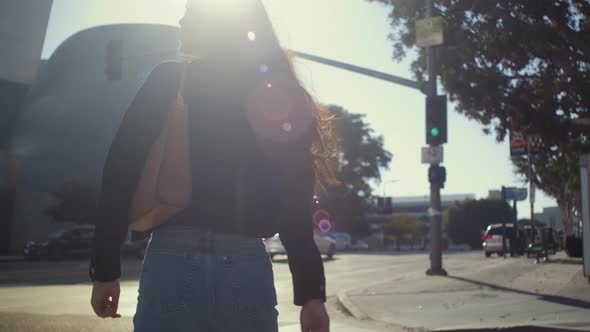 Back View Woman Walking on Bright Sunlight