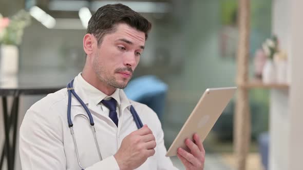 Video Call By Young Male Doctor on Tablet