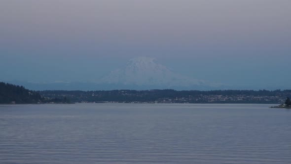 Time lapse view of Mount Rainier seen from the Fox Island Bridge looking over Hale Pass and Universi