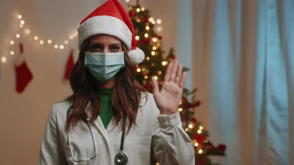 Female doctor greets at Christmas