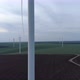 Windmill Farm on Field, Dolly in Aerial View, Passing Wind Turbine - VideoHive Item for Sale