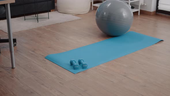 Nobody in Living Room with Sport Equipment on Floor