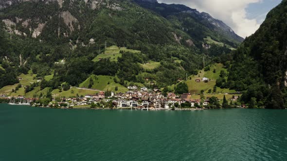 Modern Village in a Lowland Between the Alpine Mountains on the Lakeshore