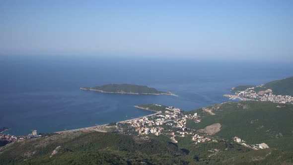 Panorama of Green Mountains in the Background of the Sea