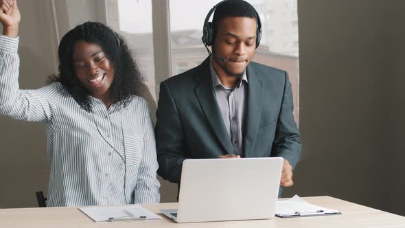 Happy Multiethnic African American Businessman Young Woman Listening Loud Music in Headphones