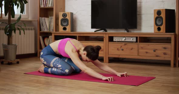 Young Woman Doing Sports and Yoga at Home