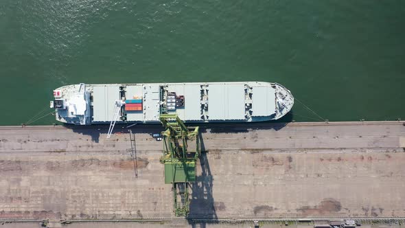 Container cargo freight ship at landmark Santos harbor port Brazil.