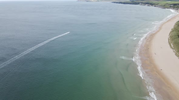 Adventure speed boat at Portrush Whiterocks beach aerial