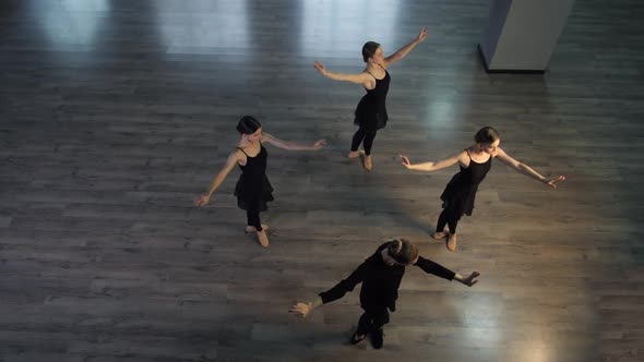 Graceful Ballerinas Practicing in Dance Hall