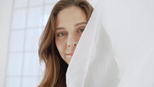 Young Beautiful Girl in White Decor