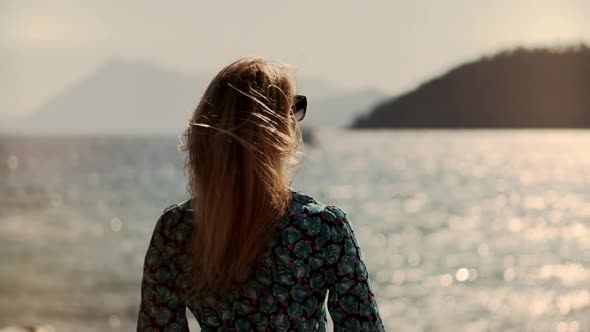 Woman Hair Flowing On Wind. Lady Enjoying Holiday Vacation And Looking On Sea. Hair Flying.