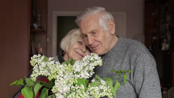 Portrait of a Happy Grandfather and Grandmother. Grandpa Kissing Gandma