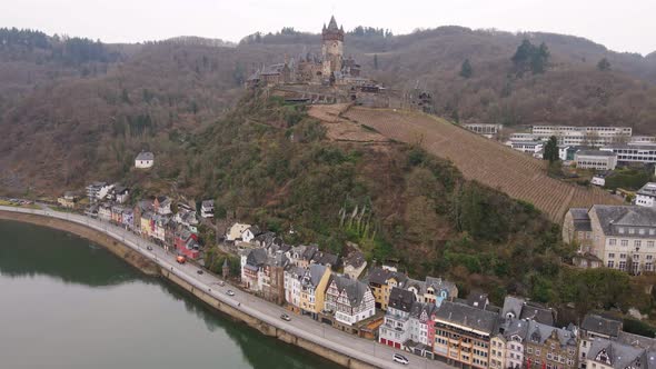 high birds eye view over the mosel river and the castle on the mountain next to the town of cochem i