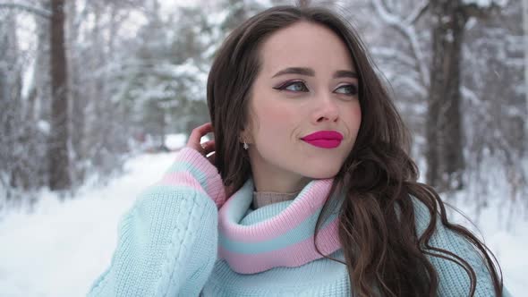 Beautiful Woman in Snowy Countryside