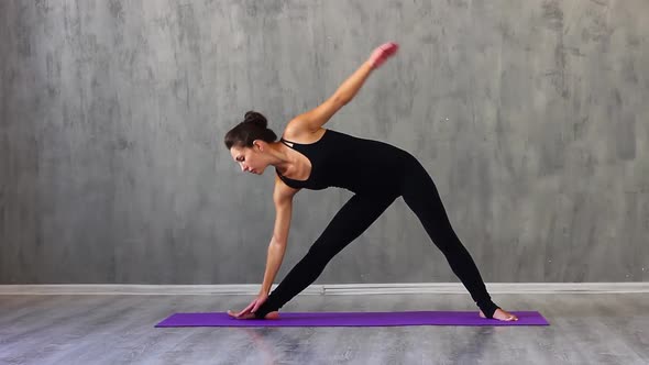 Woman Clothes Performs Gymnastic Stretching Purple Yoga Mats Against Backgroun