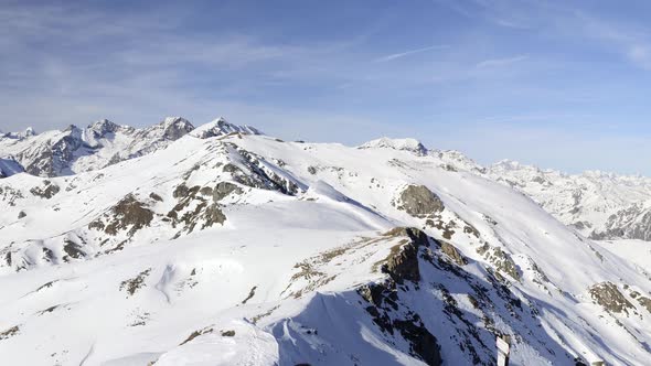 Panorama on snowcapped mountain peaks and ridges of the majestic italian Alps in winter